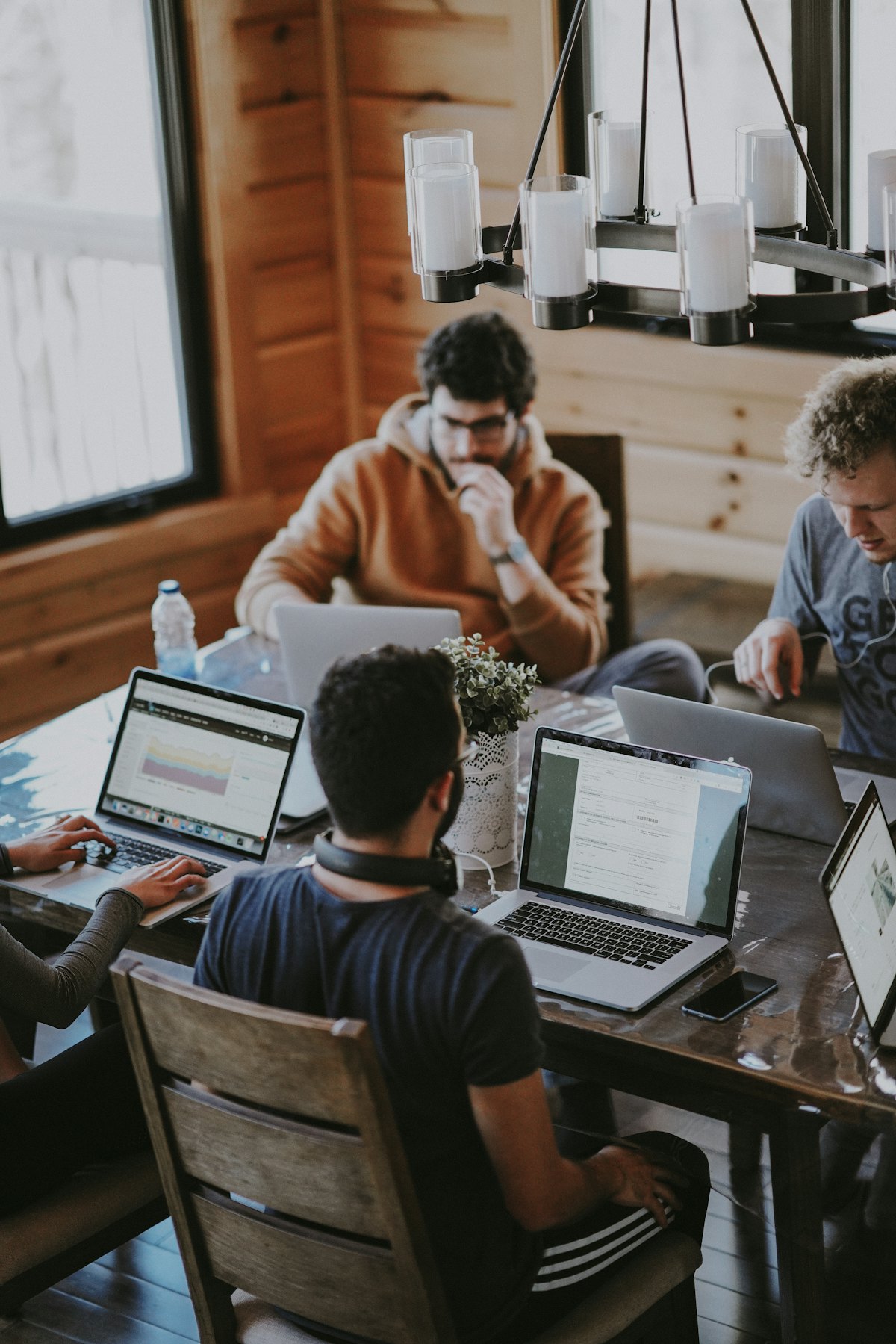A small team working together on laptops during a Google Workspace migration